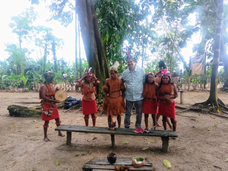 Miguel with community members during a cultural visit in the Amazon region