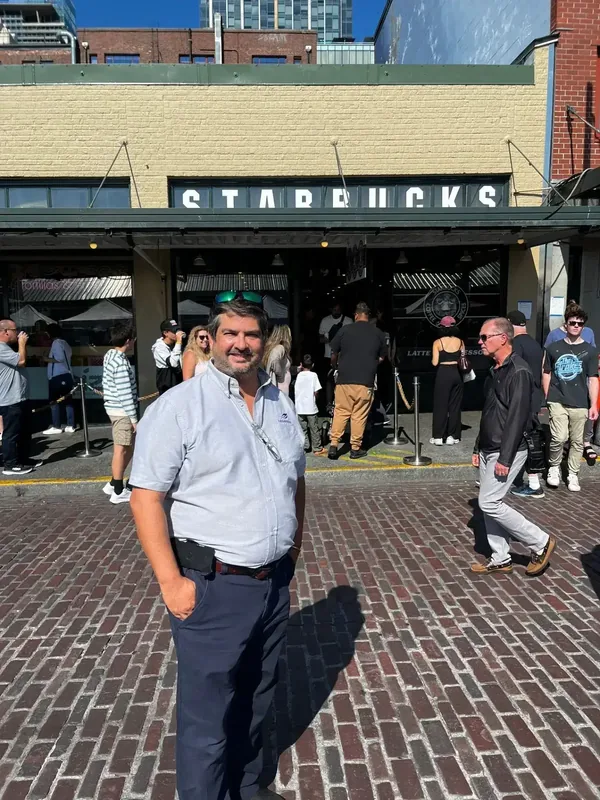 Miguel outside Starbucks at Pike Place Market in Seattle