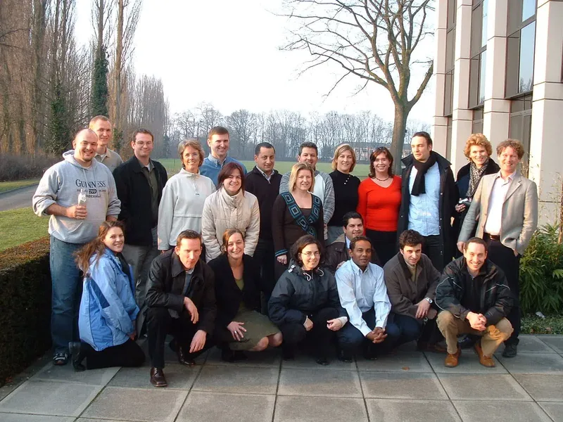 Miguel with a professional group outside a building